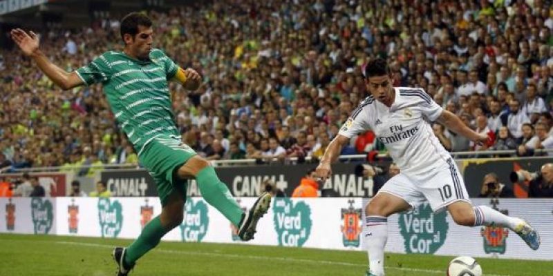 Real Madrid's Rodriguez controls the ball against Cornella's Garcia during their Spanish King's Cup soccer match in Cornella-El Prat stadium, near Barcelona